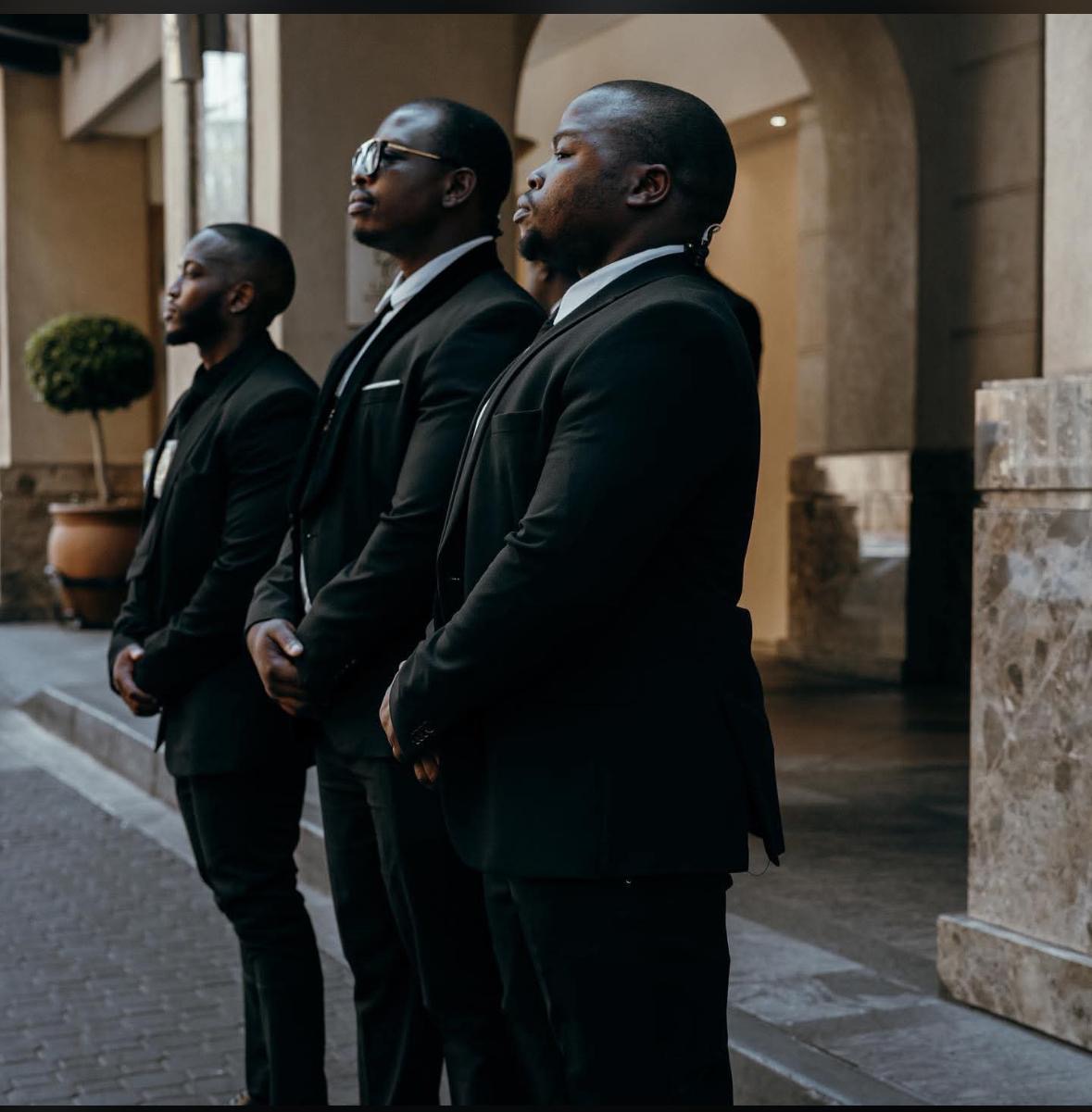 KM VIP Protection officers at attention in colonnaded courtyard, Johannesburg